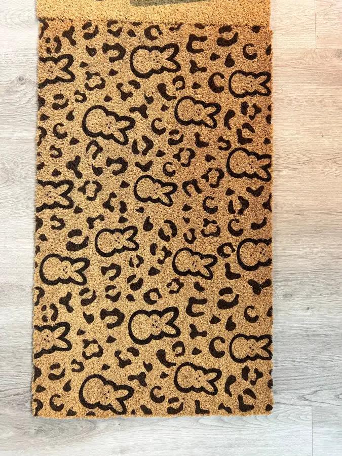 Bunny Doormat DecoExchange printed with black bunny silhouettes on tan background 18x30 on Tampa Home & Garden Store