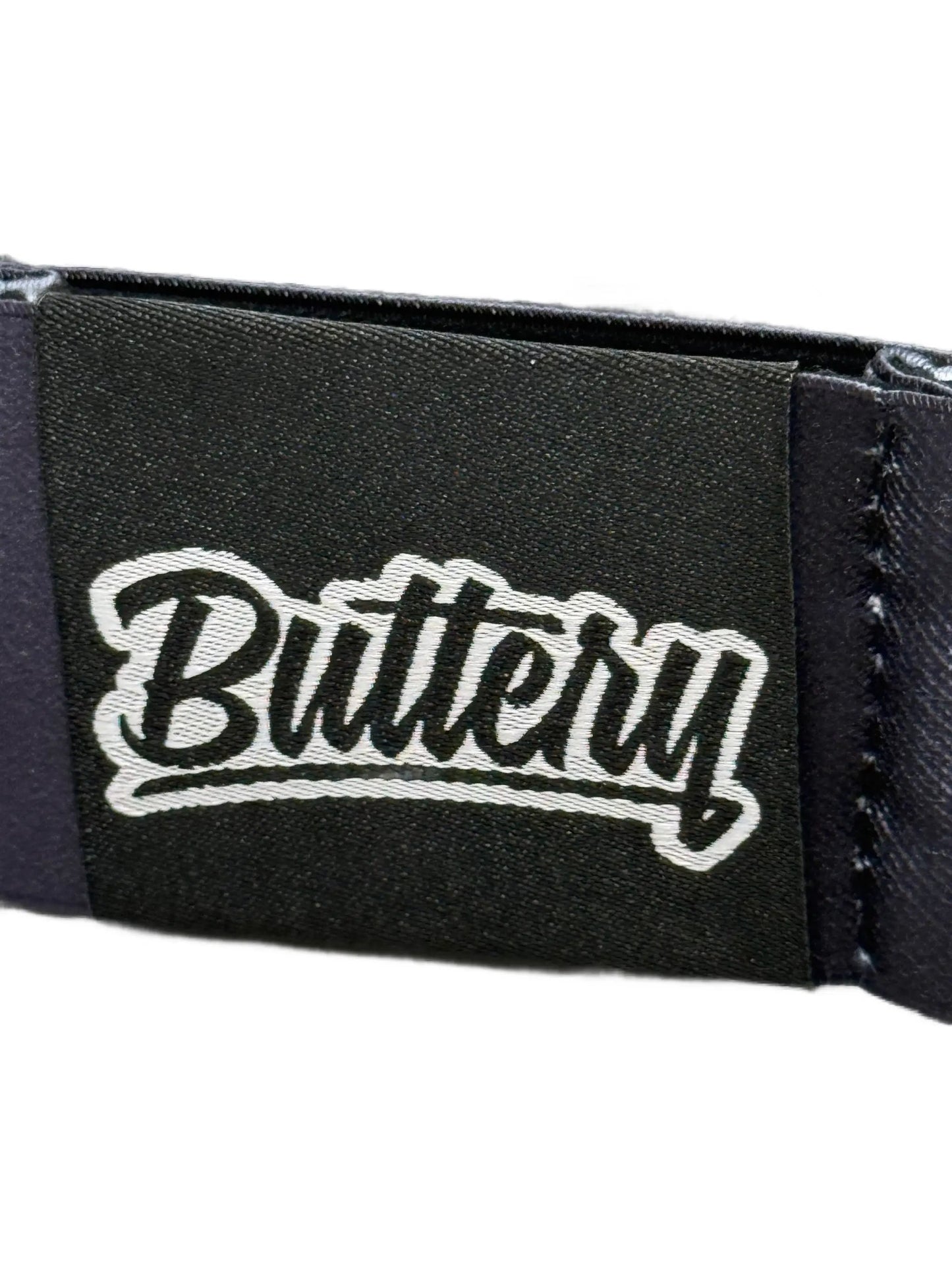 Goggles patch featuring white Buttery logo on black fabric, Helios Customizable Edition detail on Tampa Home & Garden Store