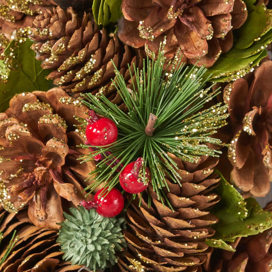 Pine cone wreath 18.5 inches with brown cones, green needles, red berries and gold glitter on Tampa Home & Garden Store