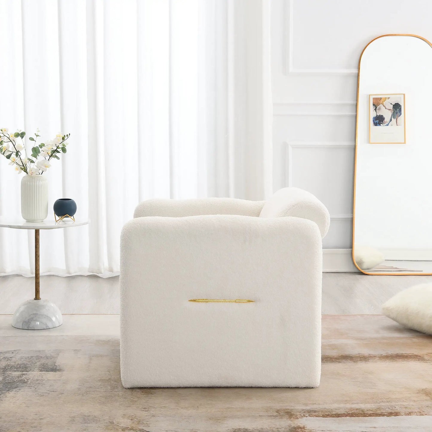 White boucle armchair with wavy armrests and metal accents on Tampa Home & Garden Store
