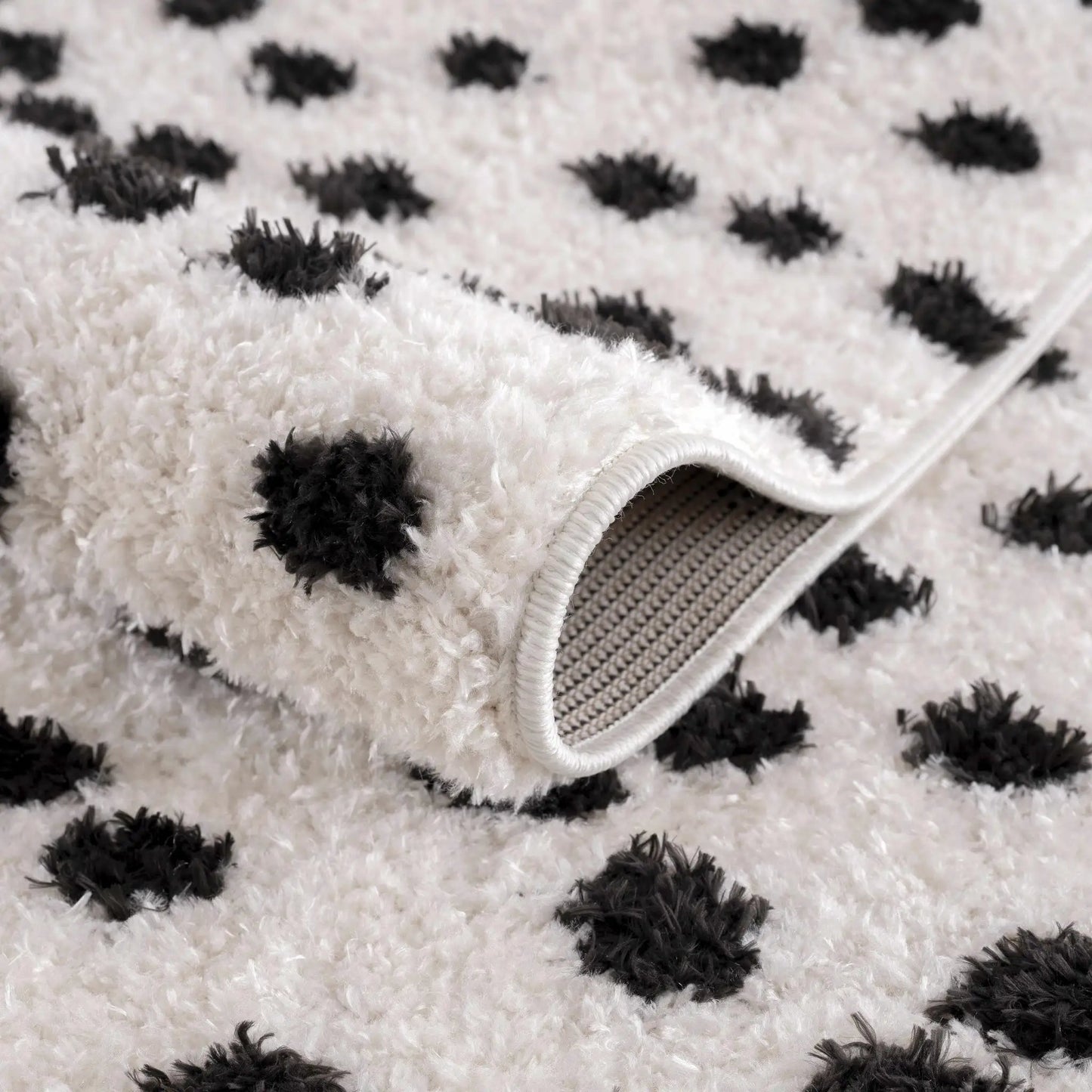 Cansu black and white dotted area rug Boutique Rugs; plush white shag with black dots on Tampa Home & Garden Store
