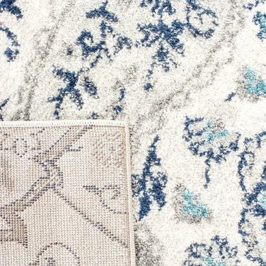 Coastal Blue Grey Damask Indoor Area Rug 5x7 with ivory background; corner shows backing on Tampa Home & Garden Store