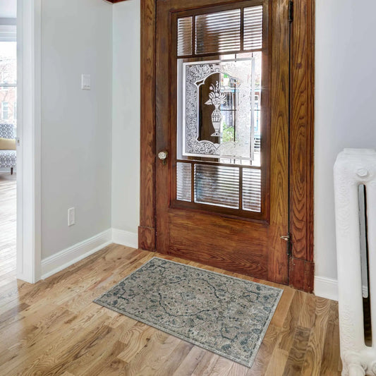 Beaudesert Luxe Fringe Rug camel with grey-blue pattern in entryway on hardwood floors on Tampa Home & Garden Store