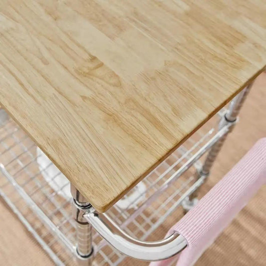Kitchen island cart with natural wood top, chrome frame, and wire shelf; pink towel draped on side on Tampa Home & Garden Store