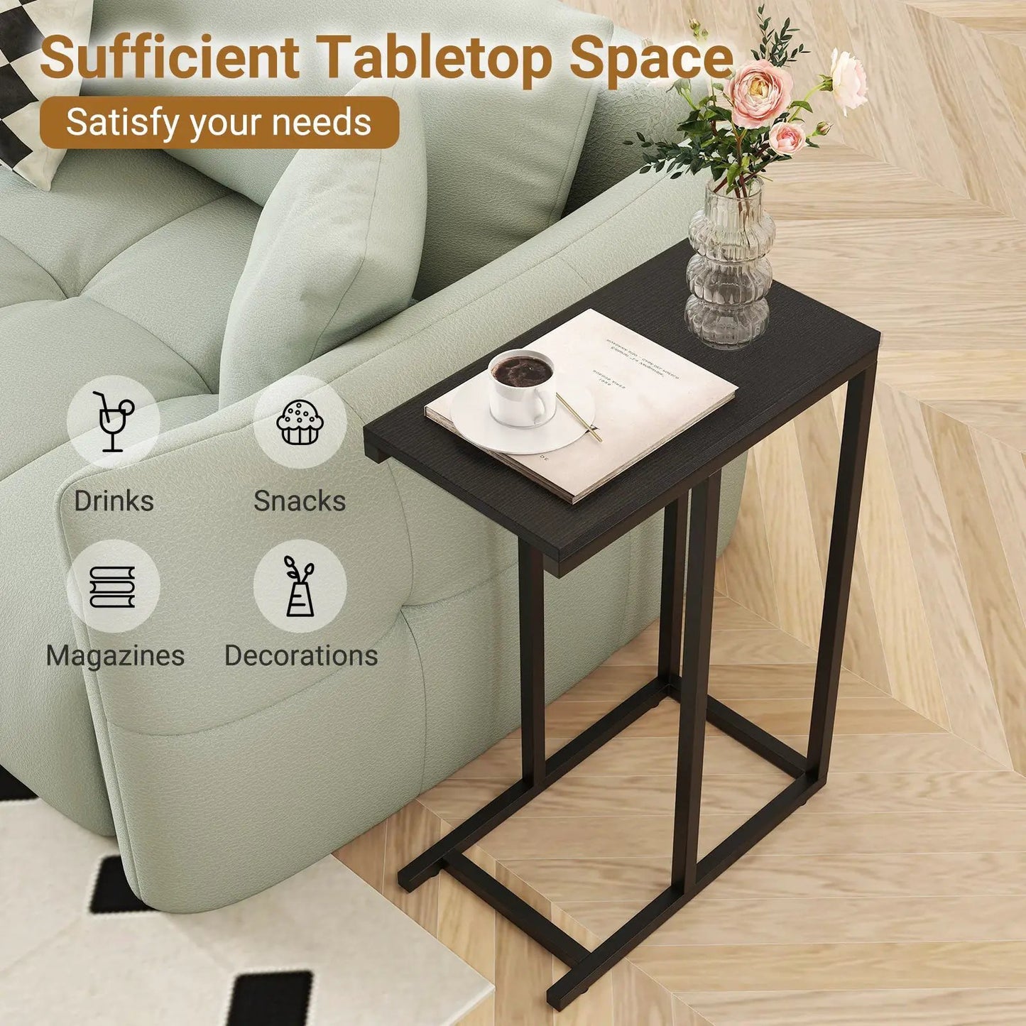 C-shaped end table with dark top and black frame beside a gray sofa holding a coffee cup and magazine on Tampa Home & Garden Store