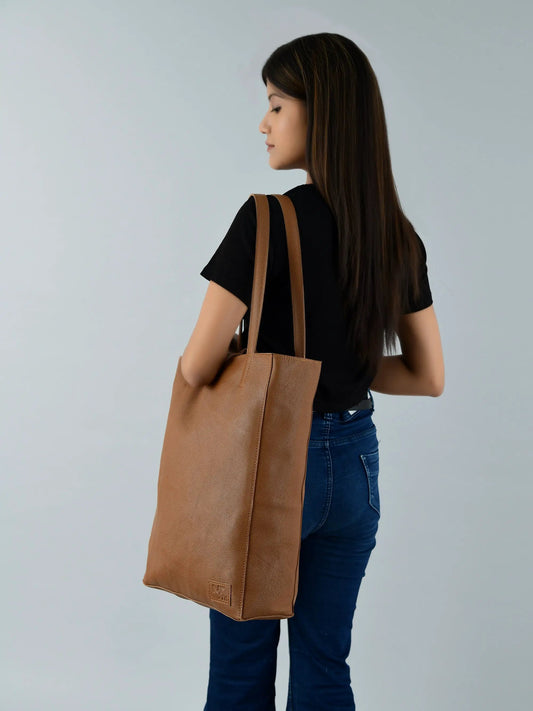 Café Chic brown leather tote bag with tan handles, Classy Leather Bags logo visible on Tampa Home & Garden Store