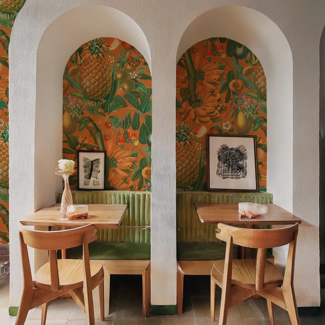 Juicy Fruit Wallpaper orange and green tropical fruit motif in arched alcove dining area on Tampa Home & Garden Store