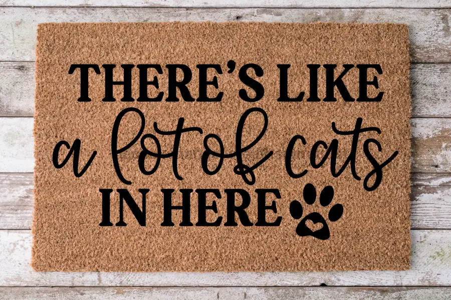 Cat doormat DecoExchange natural coir 30x18 with THERE'S LIKE a lot of cats IN HERE paw print on Tampa Home & Garden Store