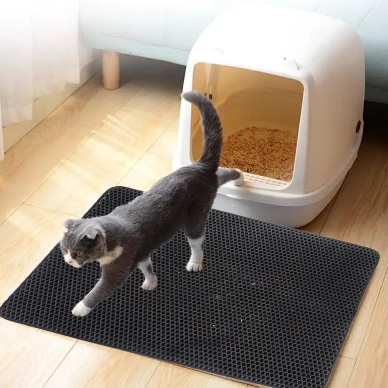 Cat Litter Pad Honeycomb Waterproof Urine Pad beside white litter box on black mat gray cat on Tampa Home & Garden Store
