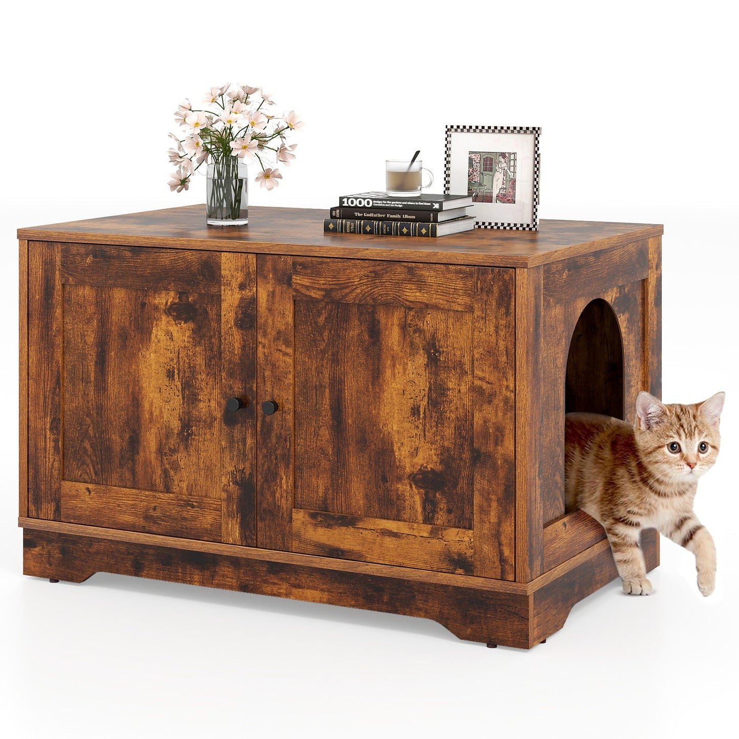 Rustic wooden cabinet with pink flower vase, books, art, mug, and a cat at the arched opening on Tampa Home & Garden Store