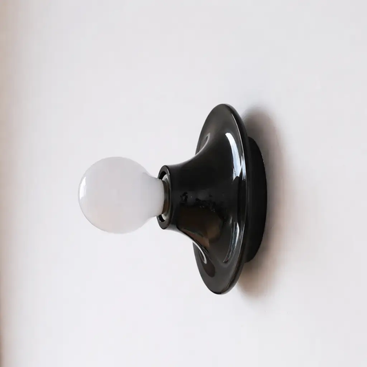 Vintage retro wall sconce with black glossy backplate and white glass bulb for corridor bedside on Tampa Home & Garden Store