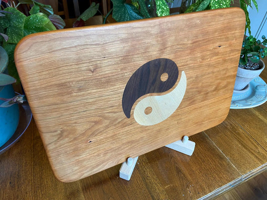 Cherry charcuterie board with yin yang inlay in dark walnut and light maple on Tampa Home & Garden Store