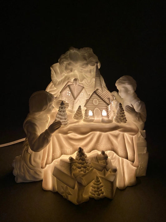 Department 56 Christmas silhouette porcelain village with lit windows and snowy trees on Tampa Home & Garden Store