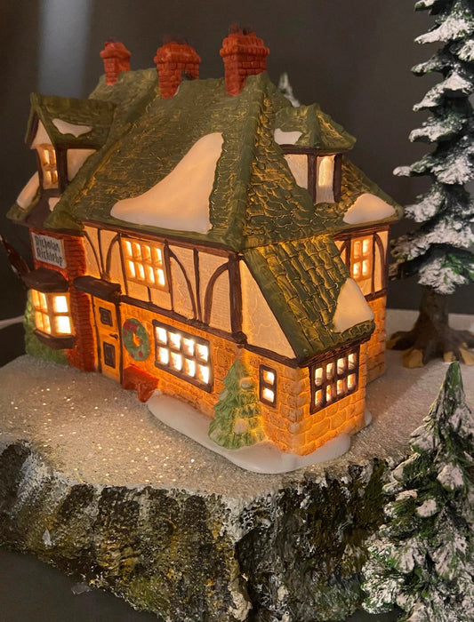 Department 56 Christmas Village House New England illuminated with warm glow and snow on Tampa Home & Garden Store