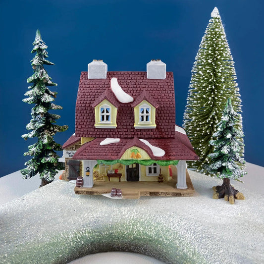 Van Tassel Manor Christmas Village by Dept 56, red-tiled manor with snow and trees on Tampa Home & Garden Store
