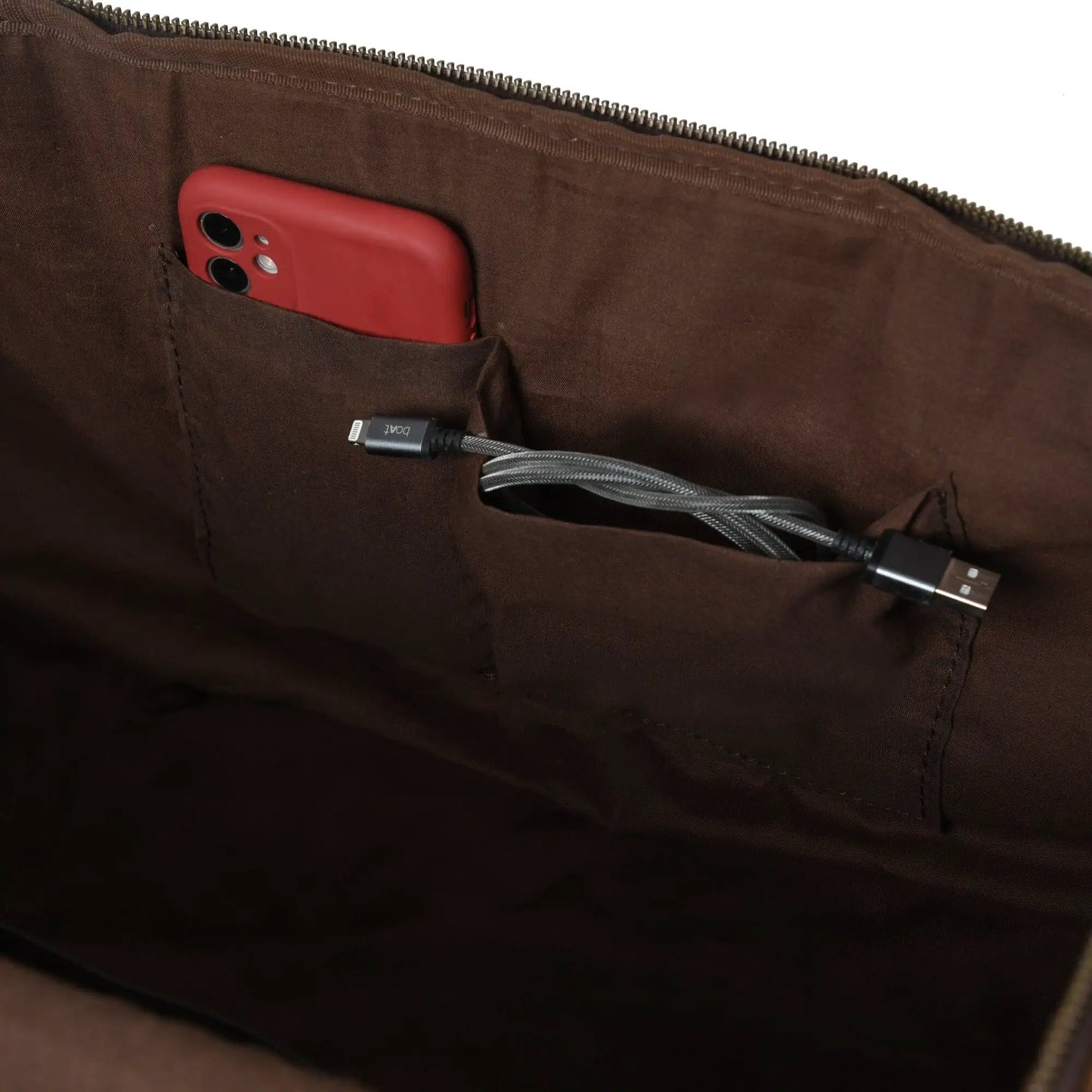 Cohen Buffalo Weekender Duffle Vintage Leather interior with red phone and USB-C cable on Tampa Home & Garden Store