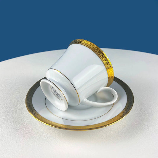 Noritake white teacup and saucer set with gold rim and braided edge on the plate on Tampa Home & Garden Store
