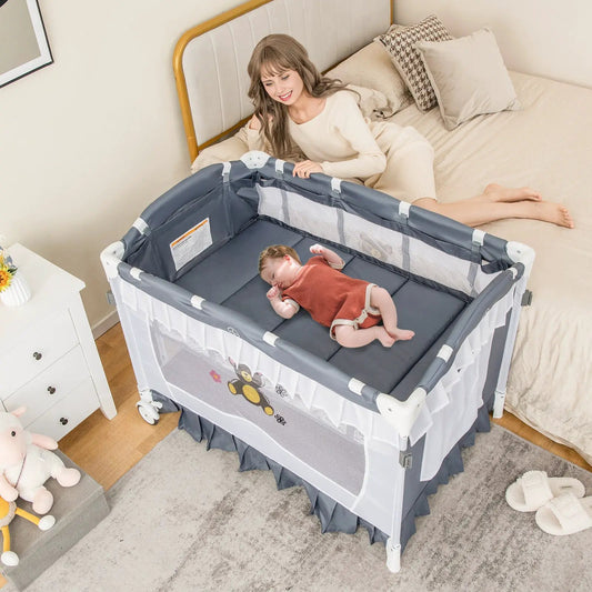Convertible bassinet with detachable mesh net in dark gray frame baby sleeping inside on Tampa Home & Garden Store