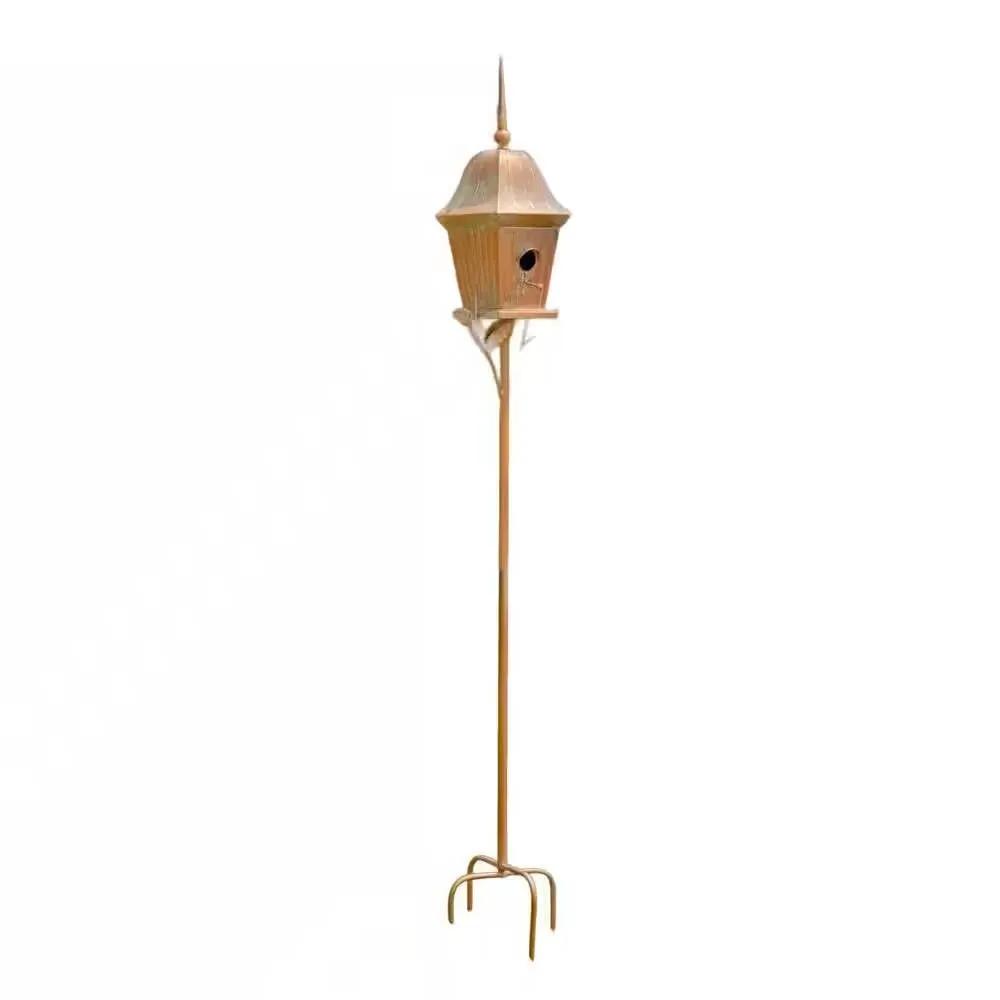 Copper finish metal garden birdhouse on tall pole with four-prong stand on Tampa Home & Garden Store