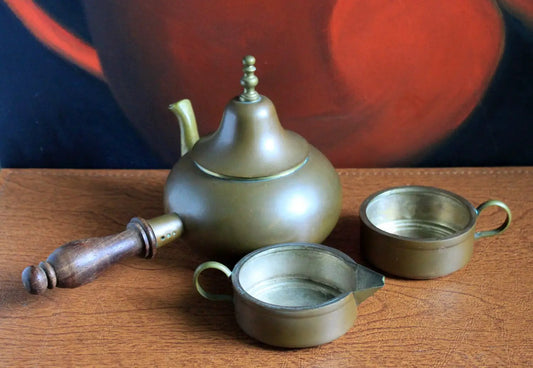 Antique copper Turkish coffee maker with wooden handle and two demitasse cups on Tampa Home & Garden Store