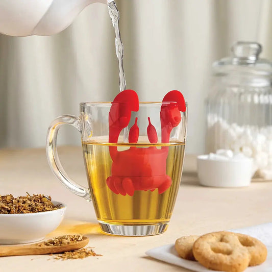 Crab Tea Infuser by OTOTO DESIGN, red silicone tea strainer with crab claws in a glass mug on Tampa Home & Garden Store