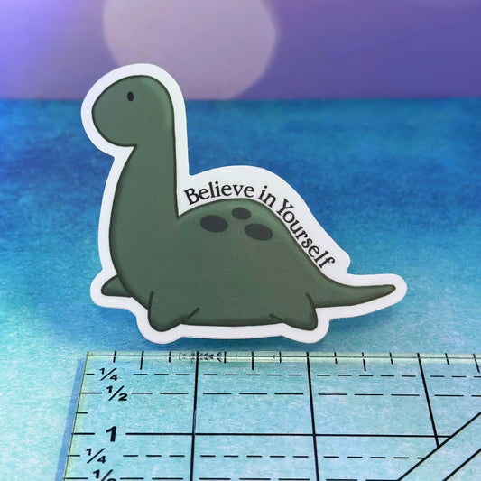 Cute Baby Nessie Believe in Yourself sticker, green Nessie with white border, 3-inch sticker on Tampa Home & Garden Store