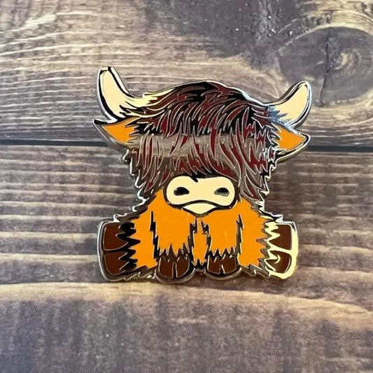Two Cute Highland Coo enamel pins set featuring a shaggy orange-brown cow with cream muzzle on Tampa Home & Garden Store