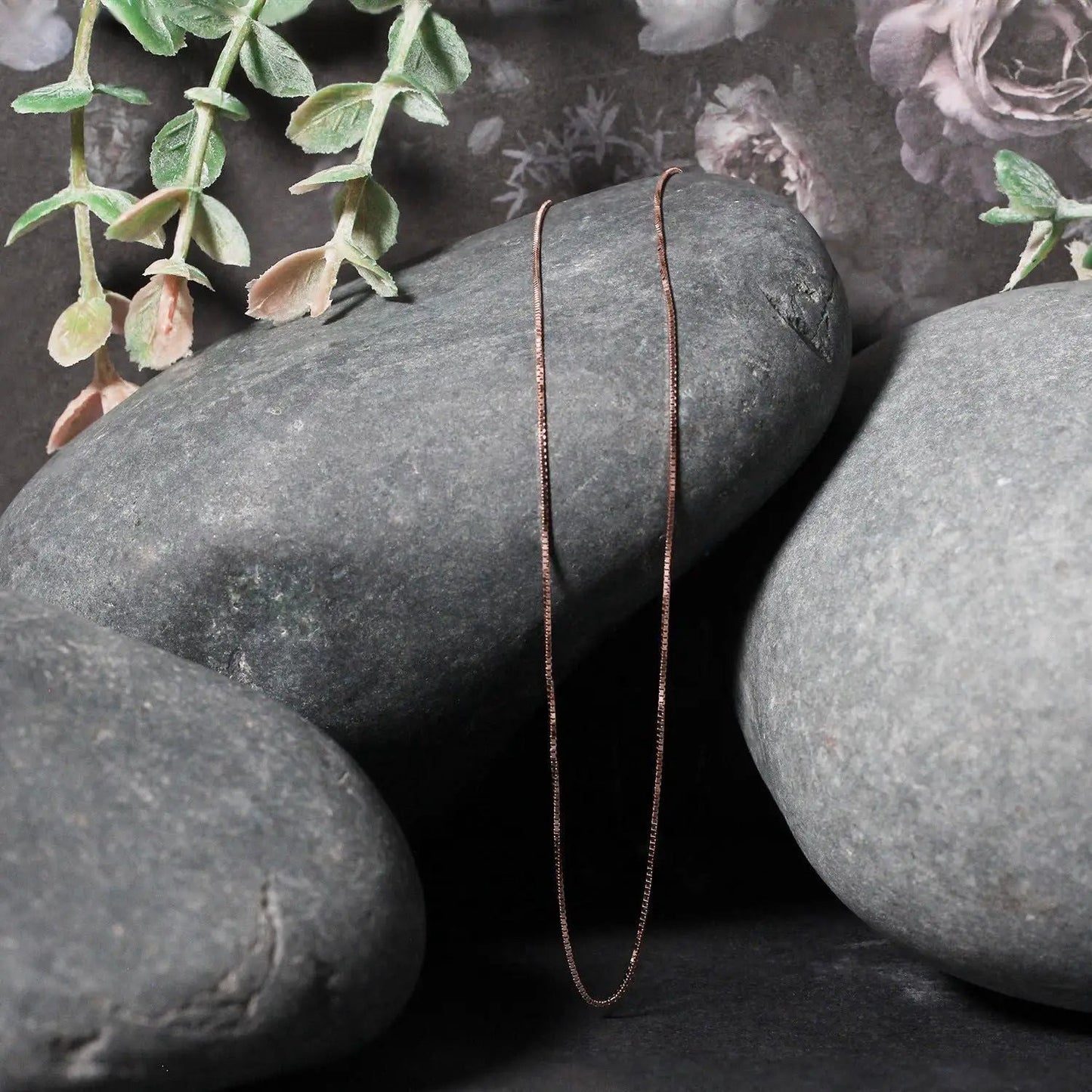 14k rose gold box chain necklace 0.6mm, slim delicate chain photographed on smooth stones on Tampa Home & Garden Store