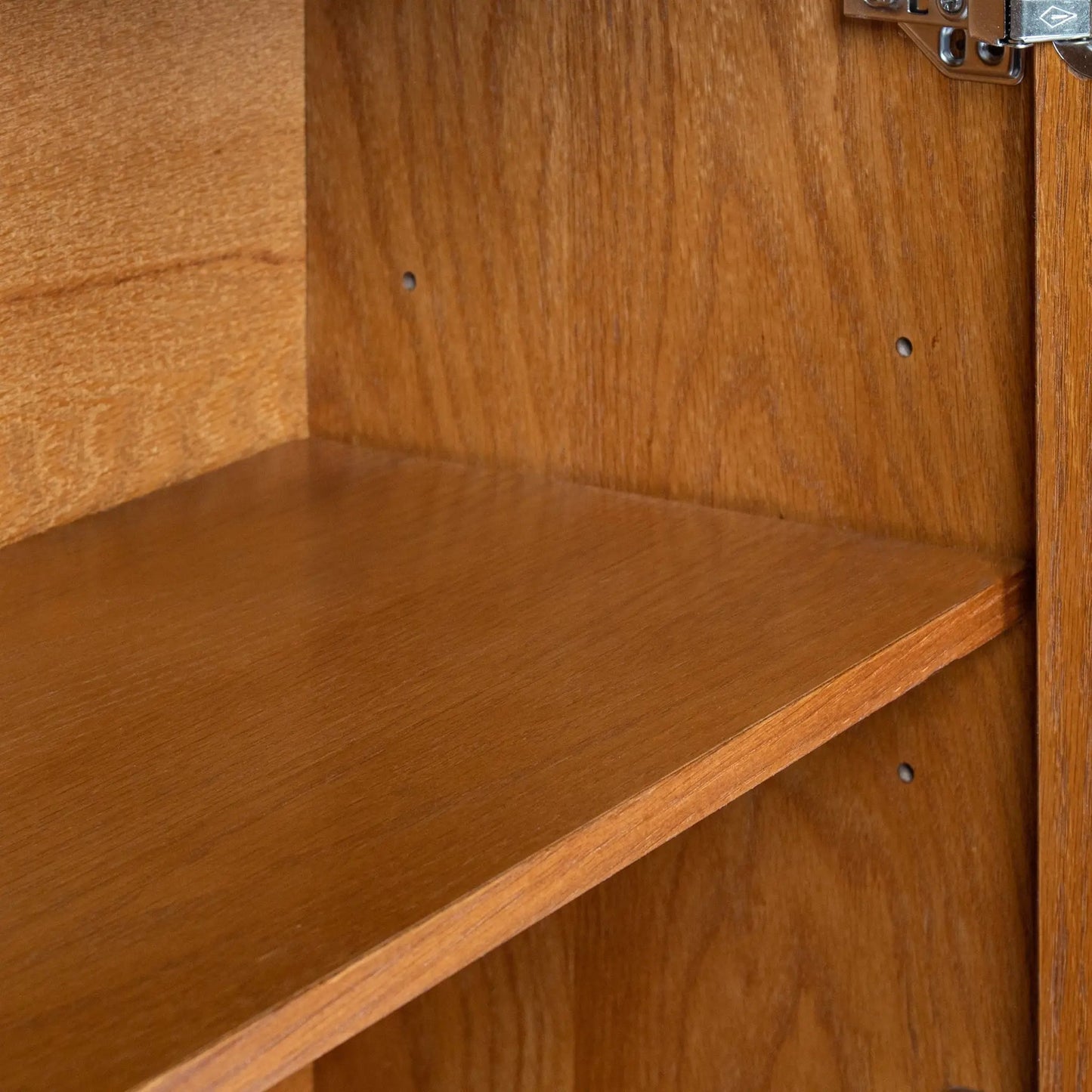 Walnut sideboard storage cabinet with adjustable shelves and visible hinge detail on Tampa Home & Garden Store