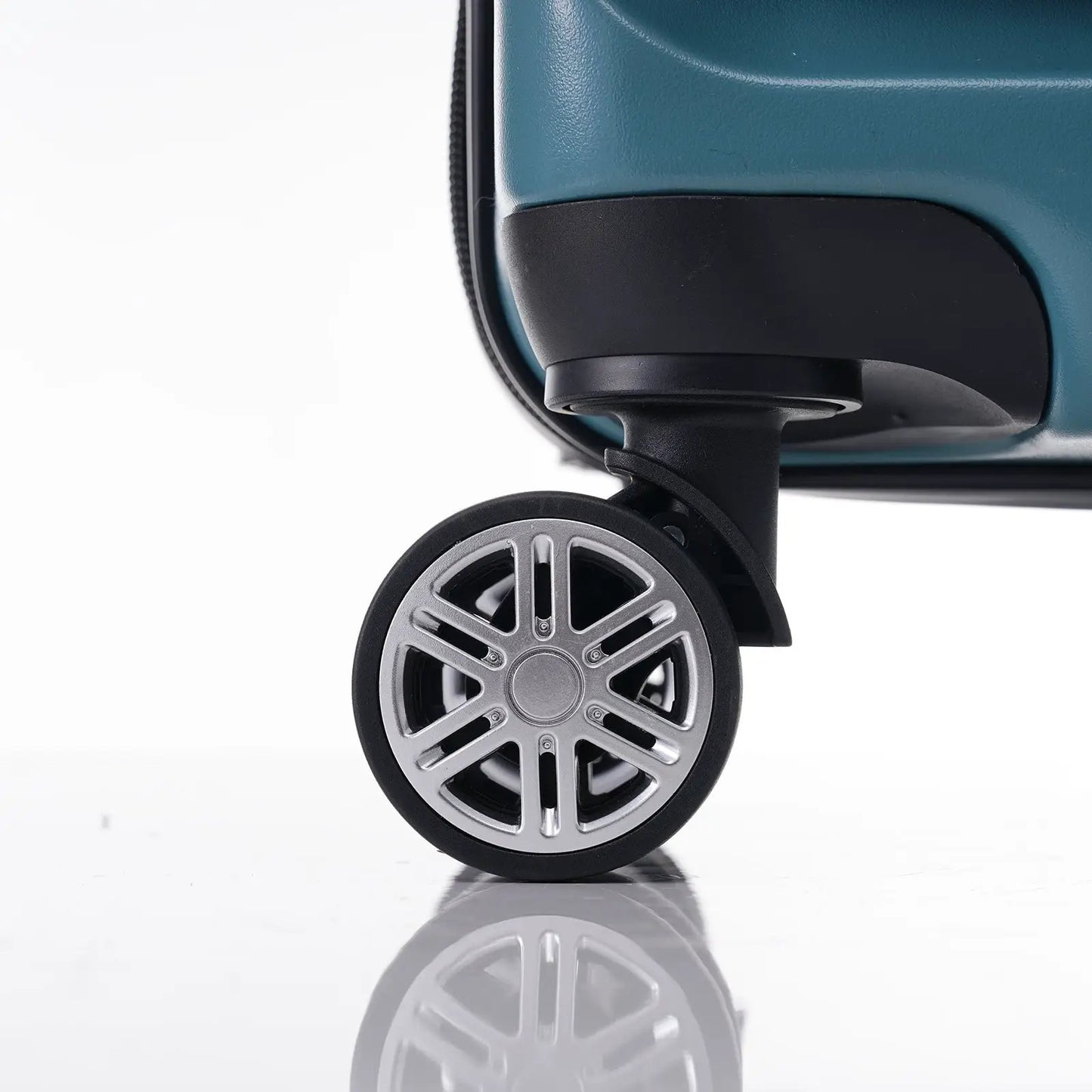 Blue 20 inch carry-on luggage wheel close-up showing teal shell and black wheel housing on Tampa Home & Garden Store