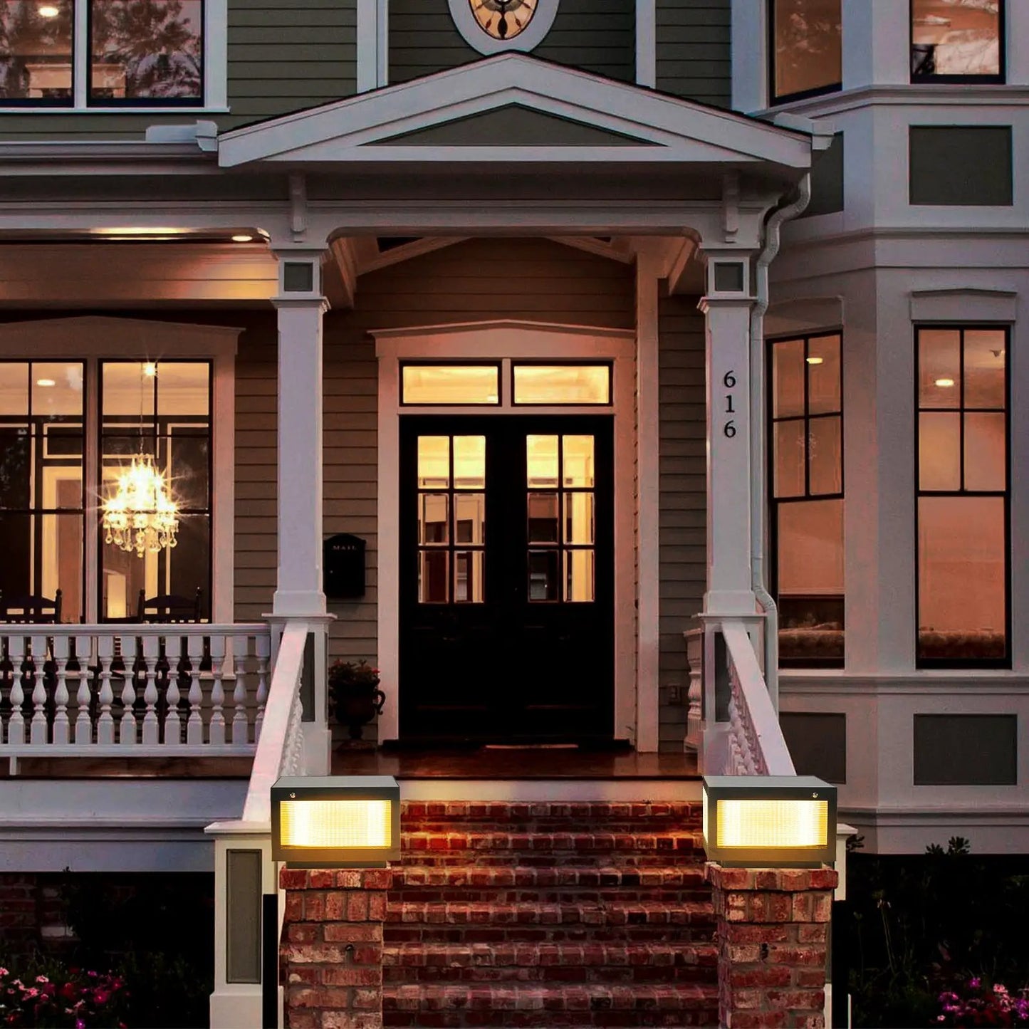 Two VIP Digital Presence solar wall lamps with dimmable LED in aluminium finish flank brick porch on Tampa Home & Garden Store