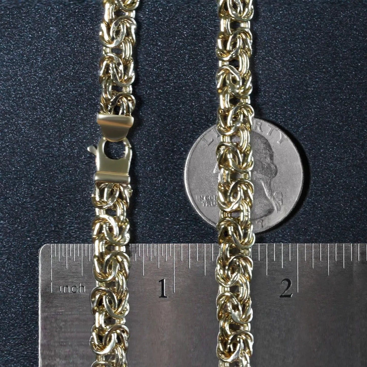 Two 14k yellow gold Byzantine chain necklaces with lobster clasps by Bids; ruler scale shown on Tampa Home & Garden Store