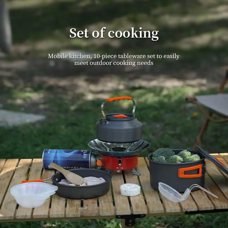 1-3 Person Camping Cookware Set with gray pot and pan, orange handles on camp stove on Tampa Home & Garden Store