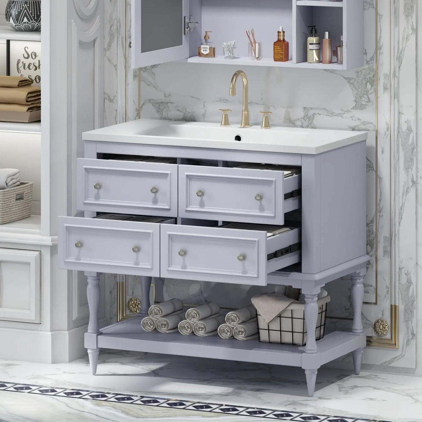 Blue 36-inch freestanding vanity with sink, gold faucet and open drawer storage against marble backsplash on Tampa Home & Garden Store