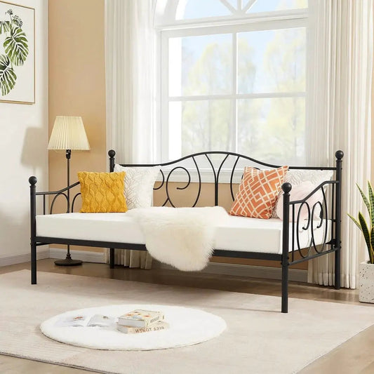 Twin size French Country black metal daybed frame with curved scrollwork in sunlit room on Tampa Home & Garden Store