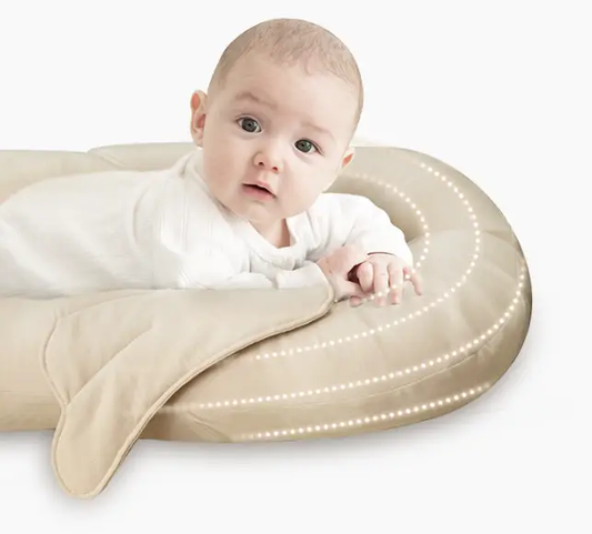 Beige circular baby nest for newborns with soft padding and dotted LED ring on Tampa Home & Garden Store