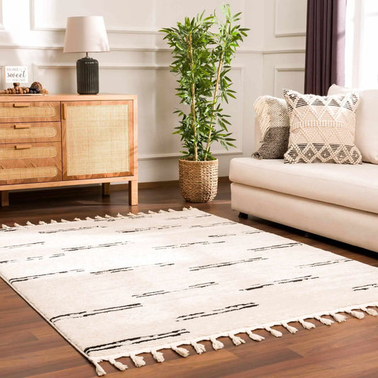 Riad black and white striped tassel rug by Boutique Rugs in living room on Tampa Home & Garden Store
