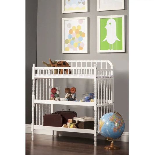 White wooden changing table with waterproof pad, slatted sides, and lower shelf in nursery on Tampa Home & Garden Store