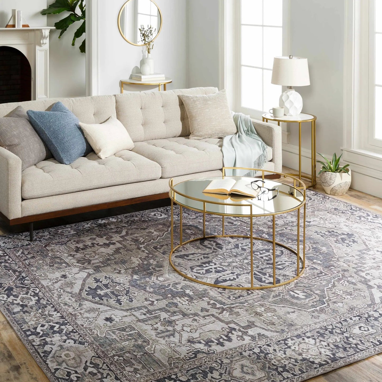 Neyland Iris Gray Area Rug medallion pattern under a beige sofa with gold tables on Tampa Home & Garden Store