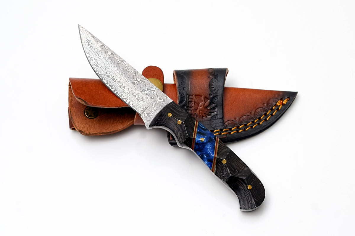 Damascus drop point hunter knife with sculpted black wood and blue resin handle in sheath on Tampa Home & Garden Store