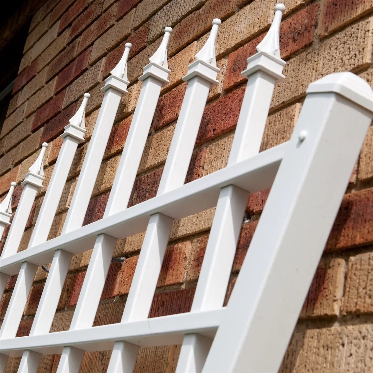 7.75 ft fan-shaped garden trellis in white vinyl with decorative finials by HomePacific on Tampa Home & Garden Store
