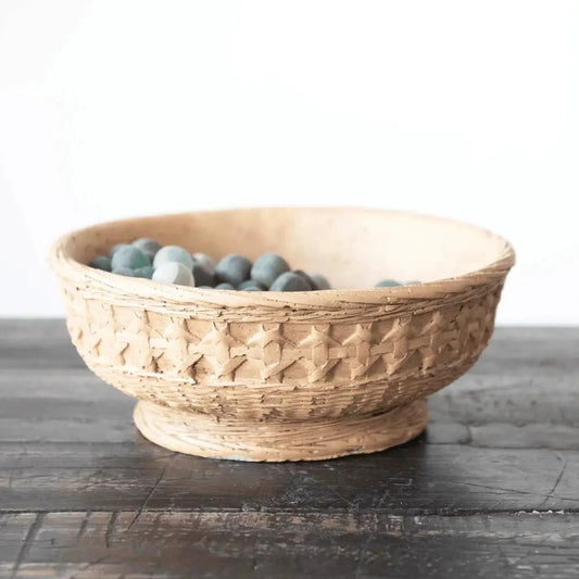 Cement bowl planter with woven exterior in natural beige, filled with blue-gray pebbles on Tampa Home & Garden Store