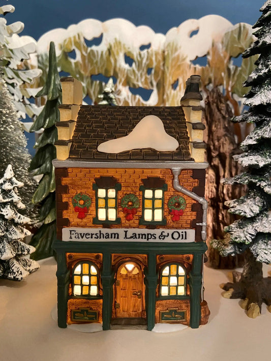 Department 56 illuminated Christmas village house with brick facade, snowy roof on Tampa Home & Garden Store