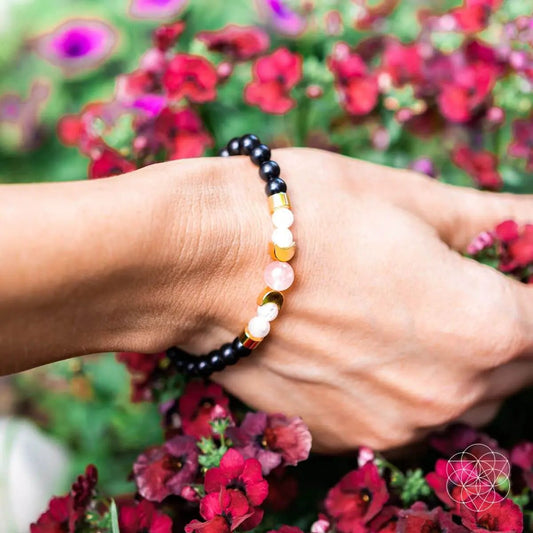 Digital Detox Shungite Bracelet EMF Support with black beads and gold spacers on wrist on Tampa Home & Garden Store