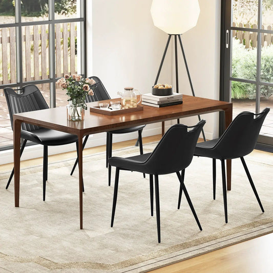 Dining chair set of 4 faux leather chairs with black metal legs around a wooden dining table on Tampa Home & Garden Store