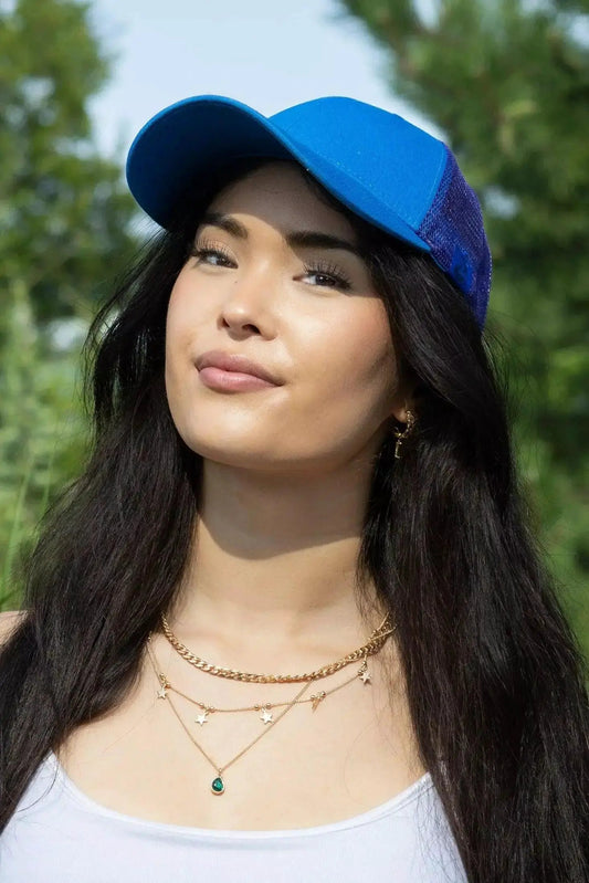 Dockside Adventures Trucker Hat by Aria the Fox, blue front with purple mesh back on Tampa Home & Garden Store