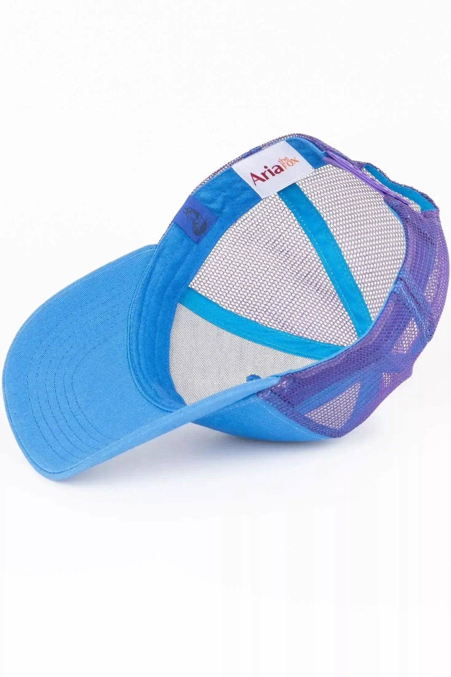Dockside Adventures Aria the Fox blue trucker hat with purple mesh back on Tampa Home & Garden Store