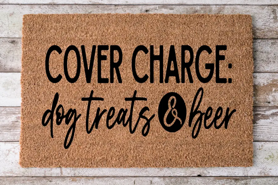 Coir doormat with bold black text Cover Charge: dog treats & beer on natural brown mat on Tampa Home & Garden Store