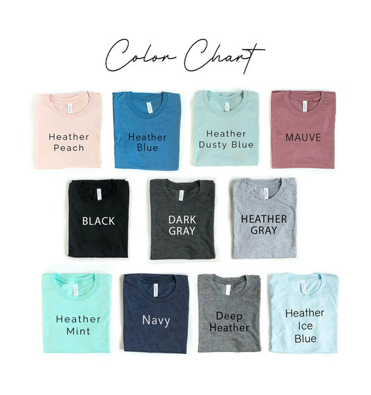 Color chart of folded Bella Canvas T-shirts in pastel and heather shades including Heather Peach, Heather Blue, Navy, Black on Tampa Home & Garden Store