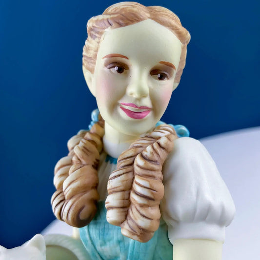 Dorothy Wizard of Oz porcelain figurine with braided hair and blue dress on Tampa Home & Garden Store